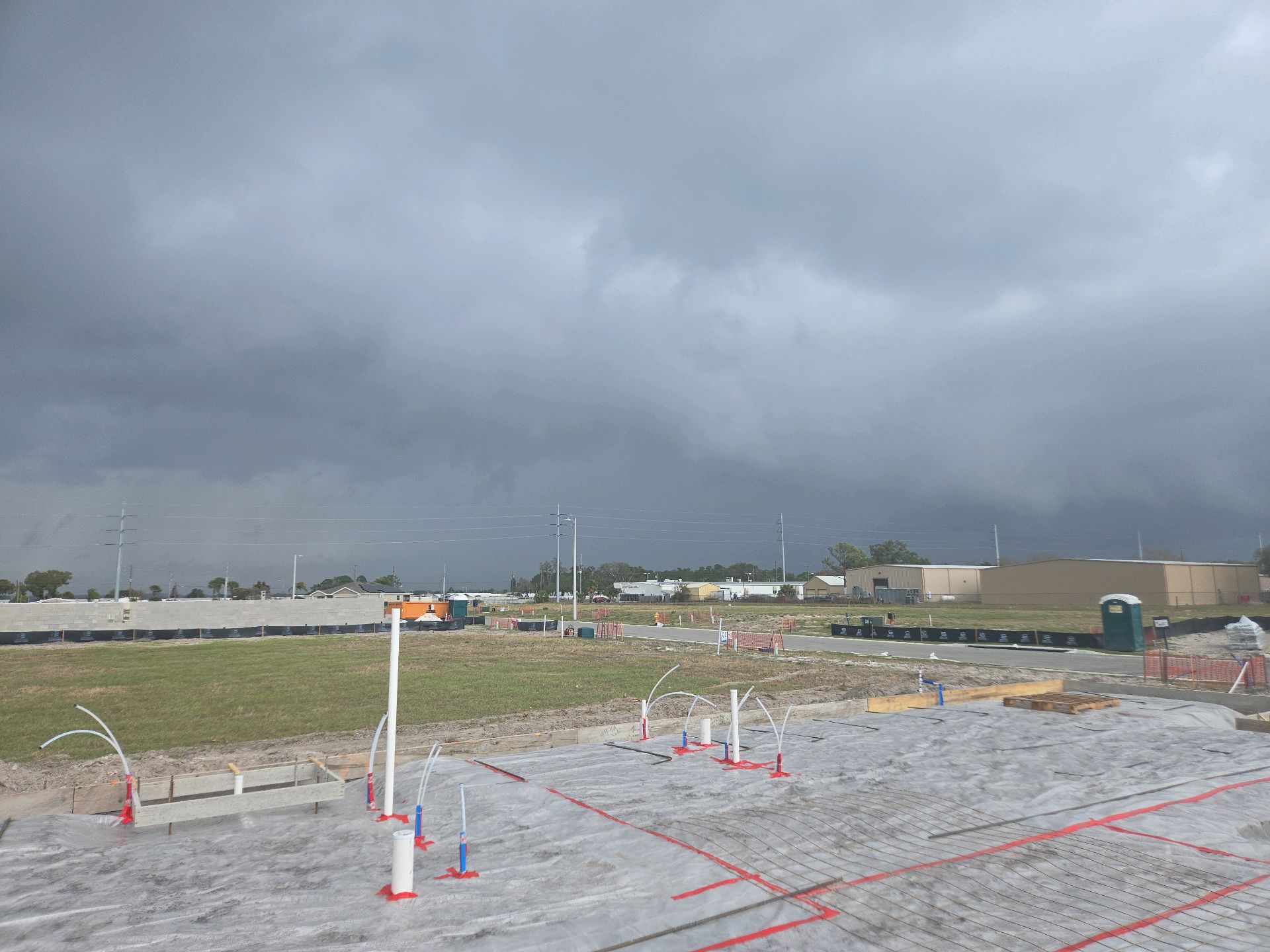 A storm front moving in over a pre-slab site set and waiting for concrete